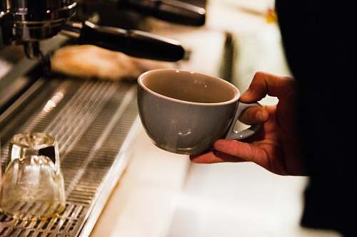 cup person holding gray ceramic mug nashville